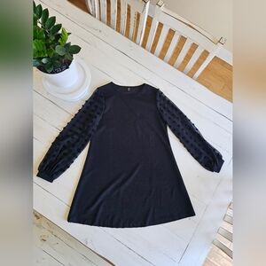 Elegant Black Mini Dress with Textured Sleeves